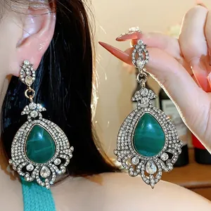 Vintage emerald green teardrop earrings with shimmering rhinestone accents for women
