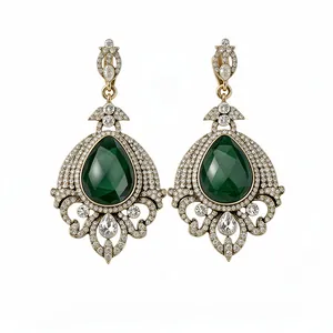 Vintage-inspired emerald green teardrop dangle earrings featuring antique gold filigree