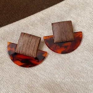Retro square wood and tortoiseshell resin stud earrings with a minimalist design style