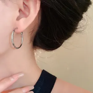 Minimalist silver hoop earrings in a classic circular design for everyday stylish fashion