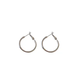 Minimalist silver-tone round hoop earrings featuring a sleek design and pin closure