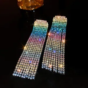 Macro detail of rainbow rhinestone fringe earrings with brilliant sparkling effect