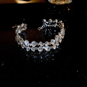 Elegant silver choker necklace with shimmering oval cubic zirconia on black surface