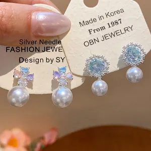 Elegant silver needle earrings with zircon flowers and pearls in Korean fashion style
