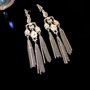 Elegant silver needle dangle earrings with teardrop crystals and long chain tassels