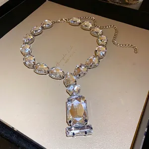 Elegant silver-tone necklace with large teardrop and rectangular clear crystal rhinestones