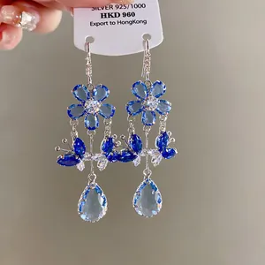 Detailed view of vintage blue zircon flower and butterfly tassel earrings in S925 silver