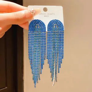 Macro detail of cascading long blue rhinestone tassel earrings with S925 silver needle post