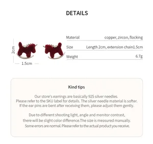 Detail view of red flocked rocking horse earrings with material and size specifications