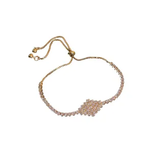 Elegant gold-tone bracelet with sparkling zircon stones and adjustable slider clasp