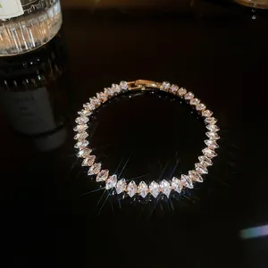 Macro view of marquise-cut zircon bracelet with brilliant fire on dark background