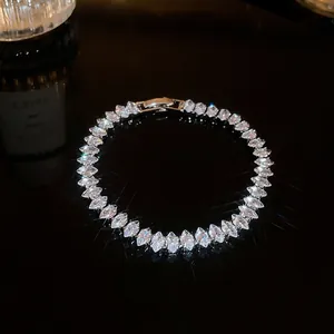 Elegant zircon bracelet featuring marquise-cut stones displayed on a dark reflective background