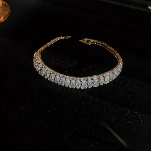 Detailed close-up of a sparkly double-row zircon crystal bracelet on black velvet