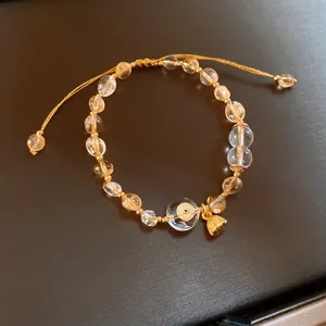 Elegantes handgefertigtes Perlenarmband mit Bergkristall und goldenem Lotusanhänger