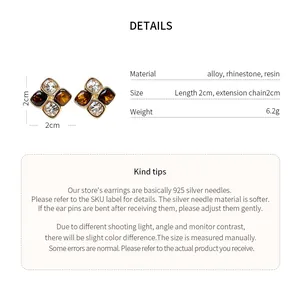 Detailed view of rhinestone resin flower earrings with size measurements and materials