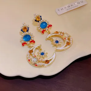 Orecchini pendenti vintage a luna e stella con strass e perle sintetiche