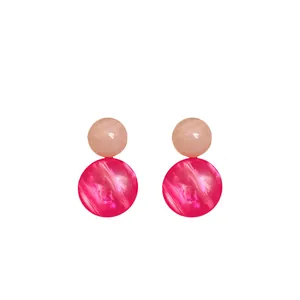 Niche vintage resin stud earrings featuring pink marble geometric spheres on white