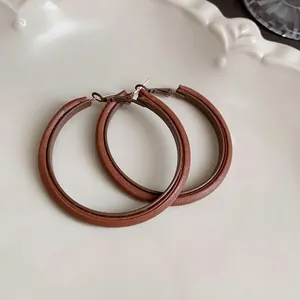 Retro brown Maillard hoop earrings with leather texture and silver needles