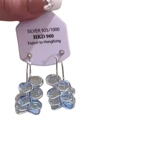 Elegant light blue floral pendant earrings with silver 925 hallmark on display card
