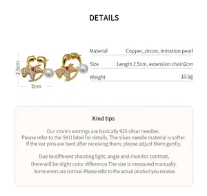 Macro detail of 18K gold plated horse shaped earrings with zircons and imitation pearls