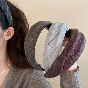 Detail view of vintage wide striped fabric headbands in elegant autumn and winter colors