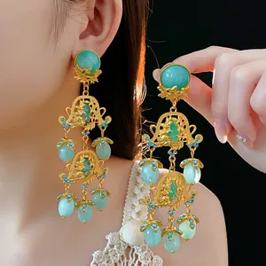 Vintage court style gold chandelier earrings with green stones and blue crystals