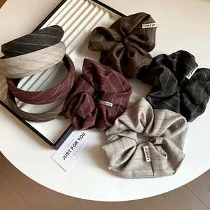 Set of retro striped fabric headbands and hair scrunchies in warm autumn colors