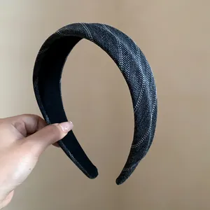 Detail view of a vintage striped wide fabric headband showing high-quality textile texture