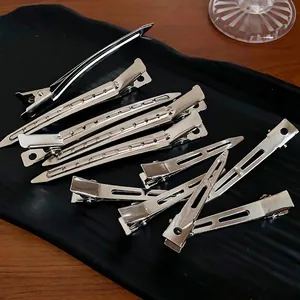 Set of minimalist silver metal duckbill hair clips for styling bangs
