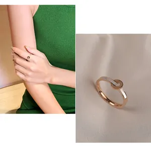 Minimalist rose gold ring with white shell inlay and Love Forever engraving detail