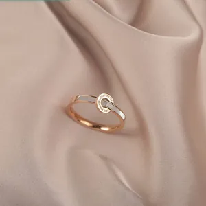 Elegant rose gold ring with white shell inlay and engraved love circle on silk