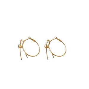 Elegant golden bow-knot hoop earrings for women with a minimalist luxury style design
