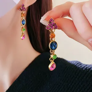 Luxurious vintage gold-tone drop earrings featuring vibrant multicolor crystals and rhinestones