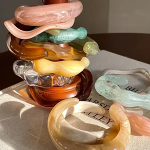 Stacked retro marbled resin bangles with a smooth, glossy minimalist finish for women.