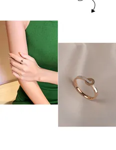 Close-up of rose gold shell ring with Forever Love engraving and model wearing view.