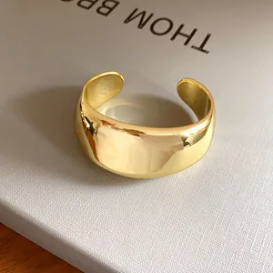 Detail showing the smooth polished gold-tone finish of this minimalist vintage cuff bracelet.