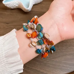 Bohemian multi-layer bracelet featuring vibrant irregular colored natural shell beads