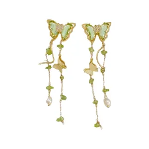 Elegant butterfly zircon pearl tassel earrings with green stone accents in gold