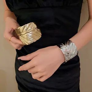 Stylish set of gold and silver metal leaf textured open cuff bracelets for women