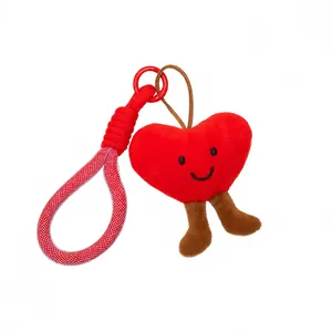 Charming red heart-shaped plush keychain with cute legs for backpacks and handbags