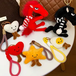 Selection of cute plush horse and star bag charms with colorful lanyards for backpacks