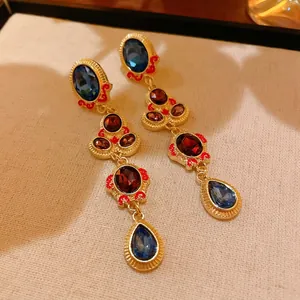 Luxury vintage gold-tone drop earrings featuring blue and red water-drop gemstones