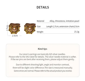Detailed view of vintage flower rhinestone earrings with pearl and size details