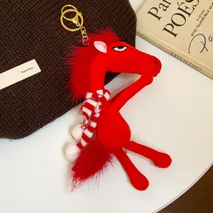 Red plush horse keychain with striped scarf and grumpy expression detail
