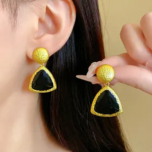 Elegant vintage gold textured earrings with black enamel dripping oil geometric design