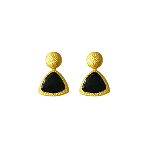 Vintage style geometric black oil-drip earrings with gold textured finish on white background