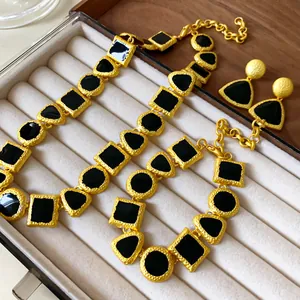 Vintage gold and black geometric enamel necklace and earring set in jewelry box