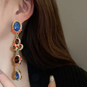Vintage gold-toned long drop earrings with blue and purple crystal stones for women