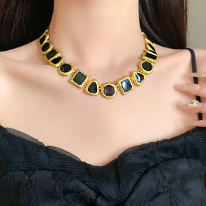 Detailed view of elegant vintage geometric enamel necklace in gold and black palace style