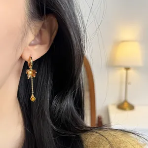 Retro tiger eye stone tassel earrings with pearls for women, high-end jewelry accessory.